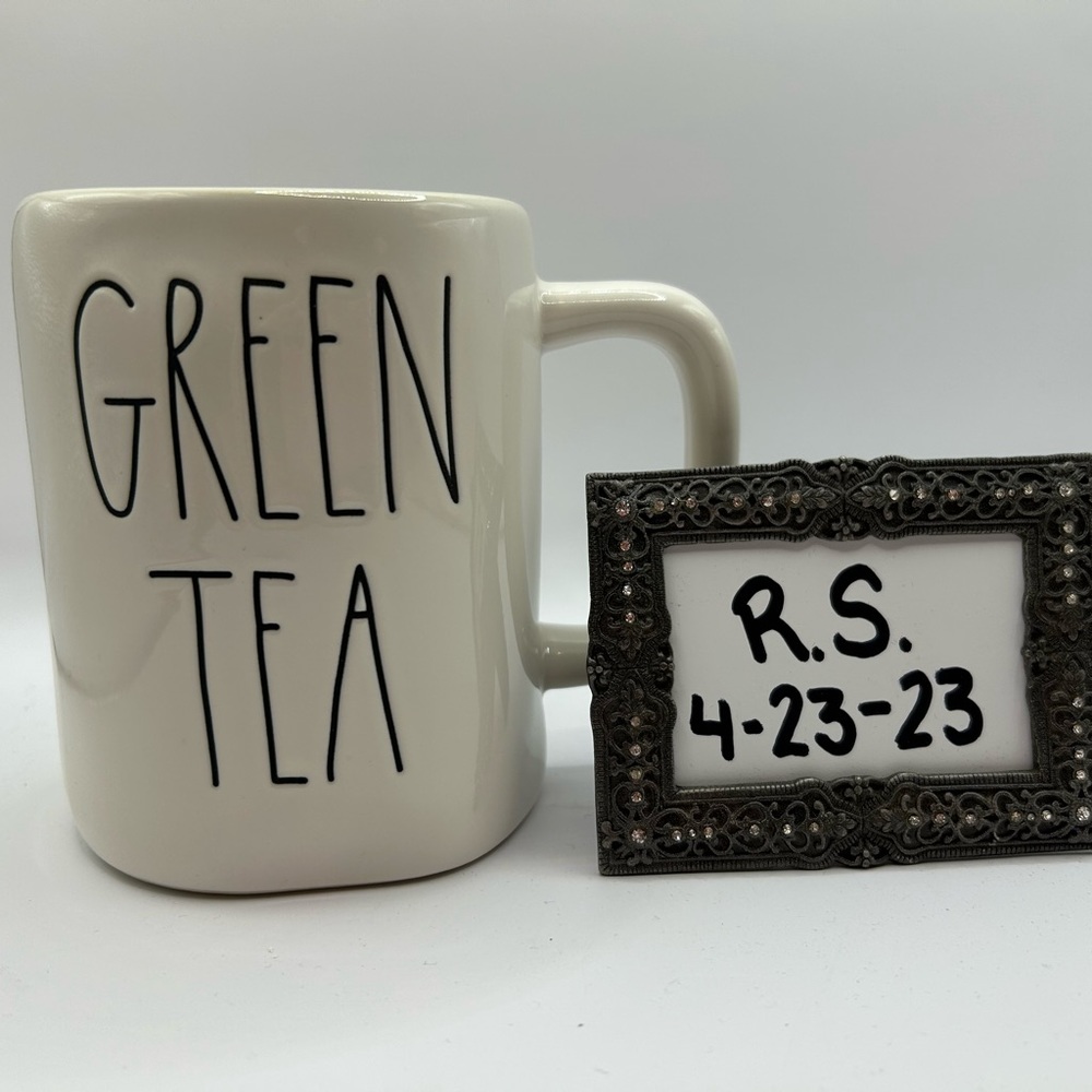 Rae Dunn “Green Tea” mug with green on the inside.